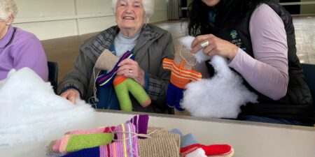 Donna stuffing bears with Hadfield Community Activities Group